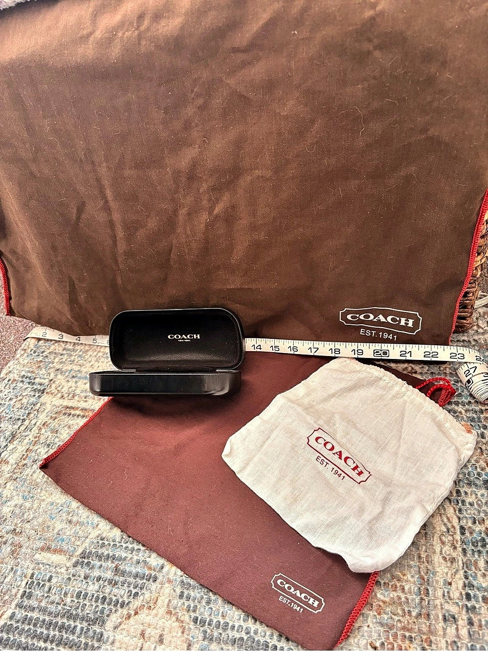 Coach dust bags in Brown & Red, White Pouch, & Black Glasses Case